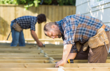 deck contractors working on deck outdoors